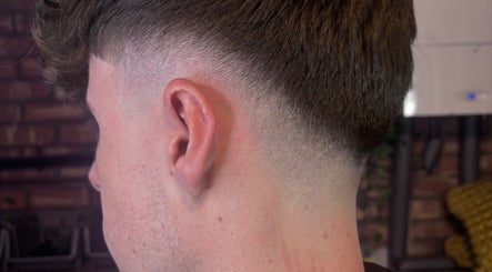 Crisp fade haircut at The Garage Chair, Cherry Burton, England, GB showcasing expert blending skills.