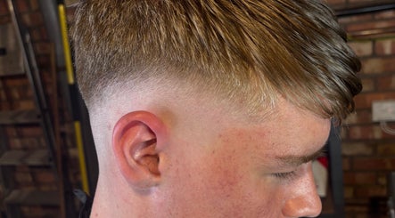 Side view of a stylish haircut at The Garage Chair, Cherry Burton, England, GB.