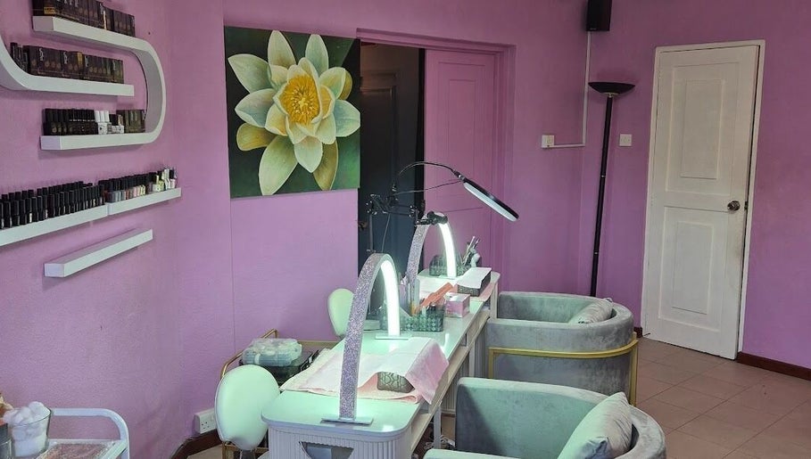 Nail salon at Revival Spa, Victoria, Beau Vallon, SC with purple decor and soothing lotus artwork.