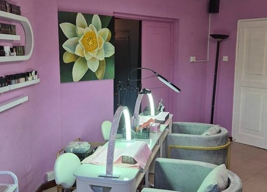 Nail salon at Revival Spa, Victoria, Beau Vallon, SC with purple decor and soothing lotus artwork.