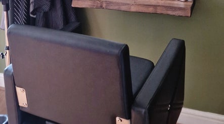 Elegant black styling chair at TasHair, Blacon, England, GB, showcasing a modern beauty salon interior.