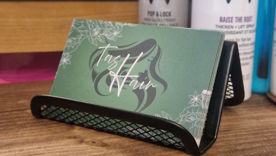 Elegant TasHair business cards displayed in Blacon, England, GB salon.