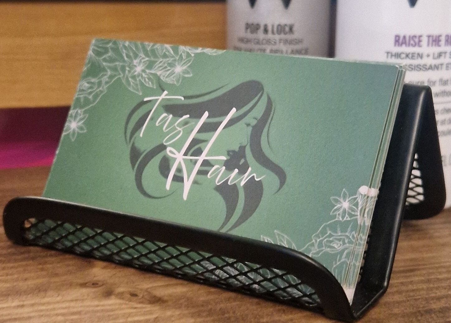 Elegant TasHair business cards displayed in Blacon, England, GB salon.