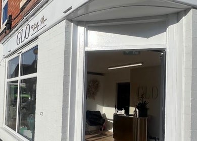 Bright entrance of Laurencoyhair salon in Leicester, England, GB, showcasing modern design.