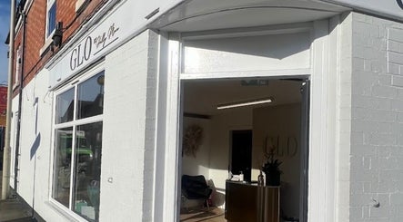 Bright entrance of Laurencoyhair salon in Leicester, England, GB, showcasing modern design.