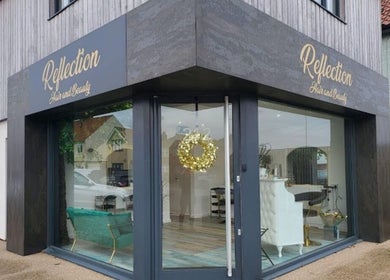 Chic salon entrance of Beauty by Rhianne located in Norwich, England, GB, with stylish glass windows.