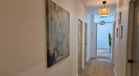 Elegant hallway at Lash Mode Co. in Subiaco, Western Australia, AU adorned with captivating wall art and ambiance.