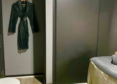 Relaxing spa room at Hillside Remedial and Spa, Melbourne, Victoria, AU. Featuring a cozy robe and treatment table.