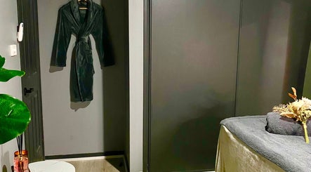 Relaxing spa room at Hillside Remedial and Spa, Melbourne, Victoria, AU. Featuring a cozy robe and treatment table.