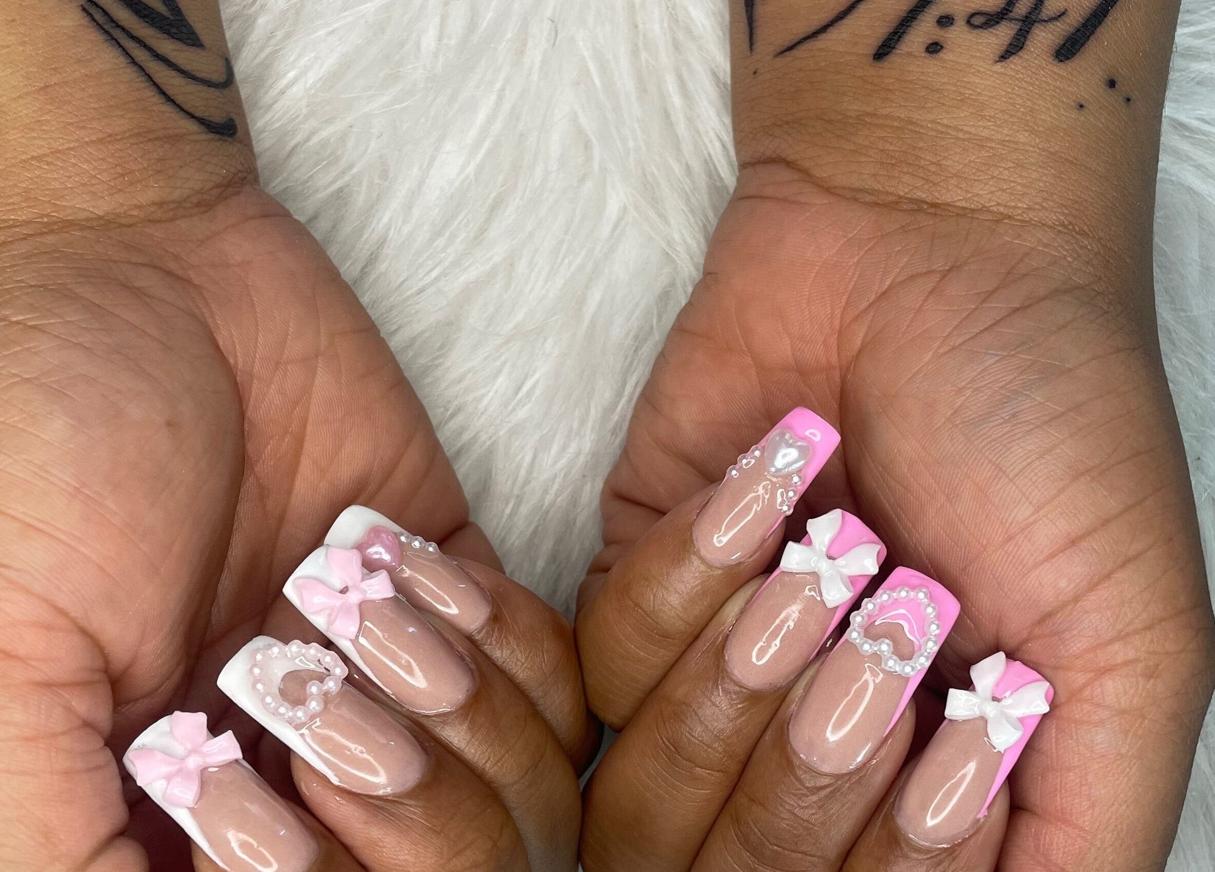 Pink and white bow nail art by Trust Beauty Studio in Randburg, Gauteng, ZA, showcasing detailed manicure design.