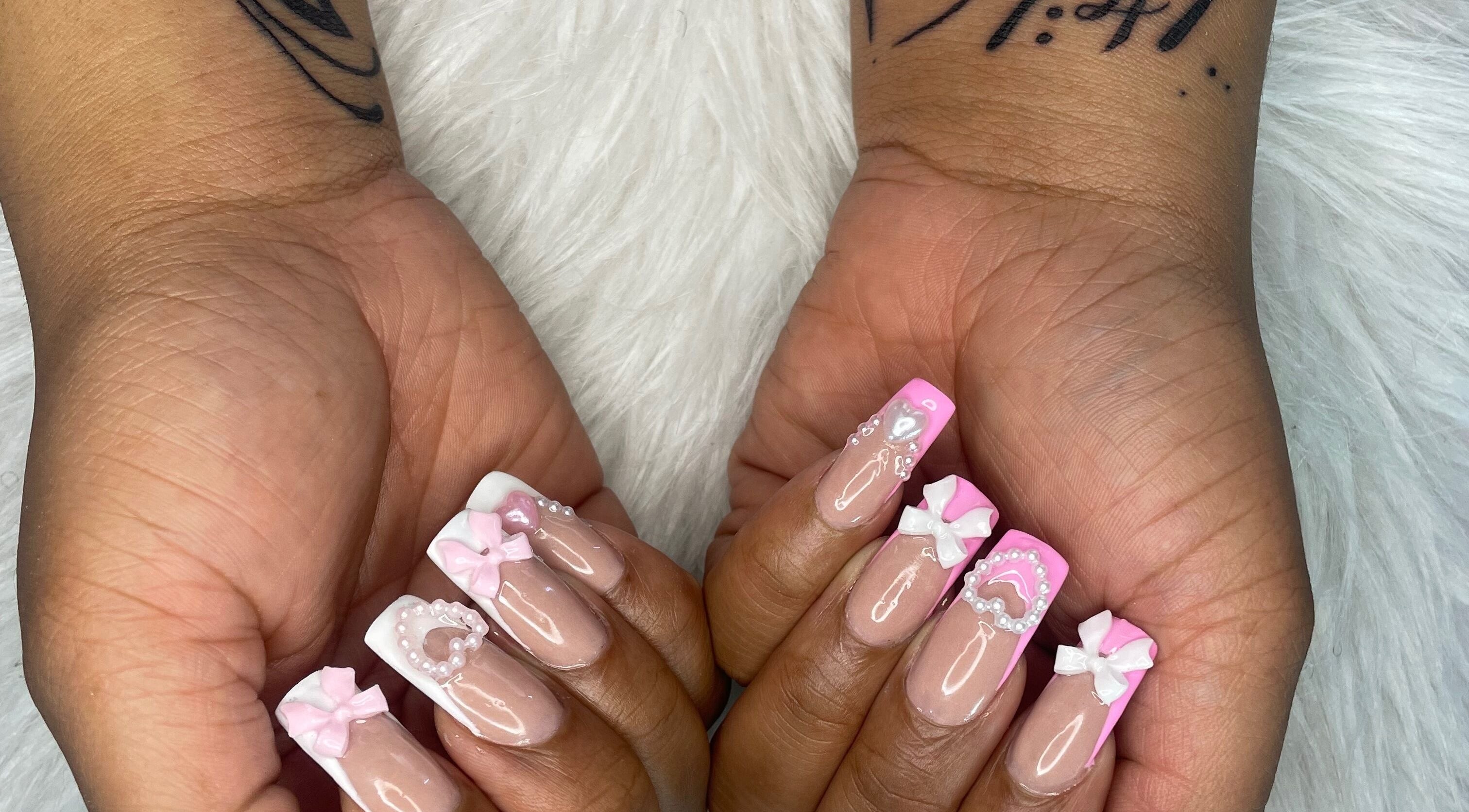 Pink and white bow nail art by Trust Beauty Studio in Randburg, Gauteng, ZA, showcasing detailed manicure design.