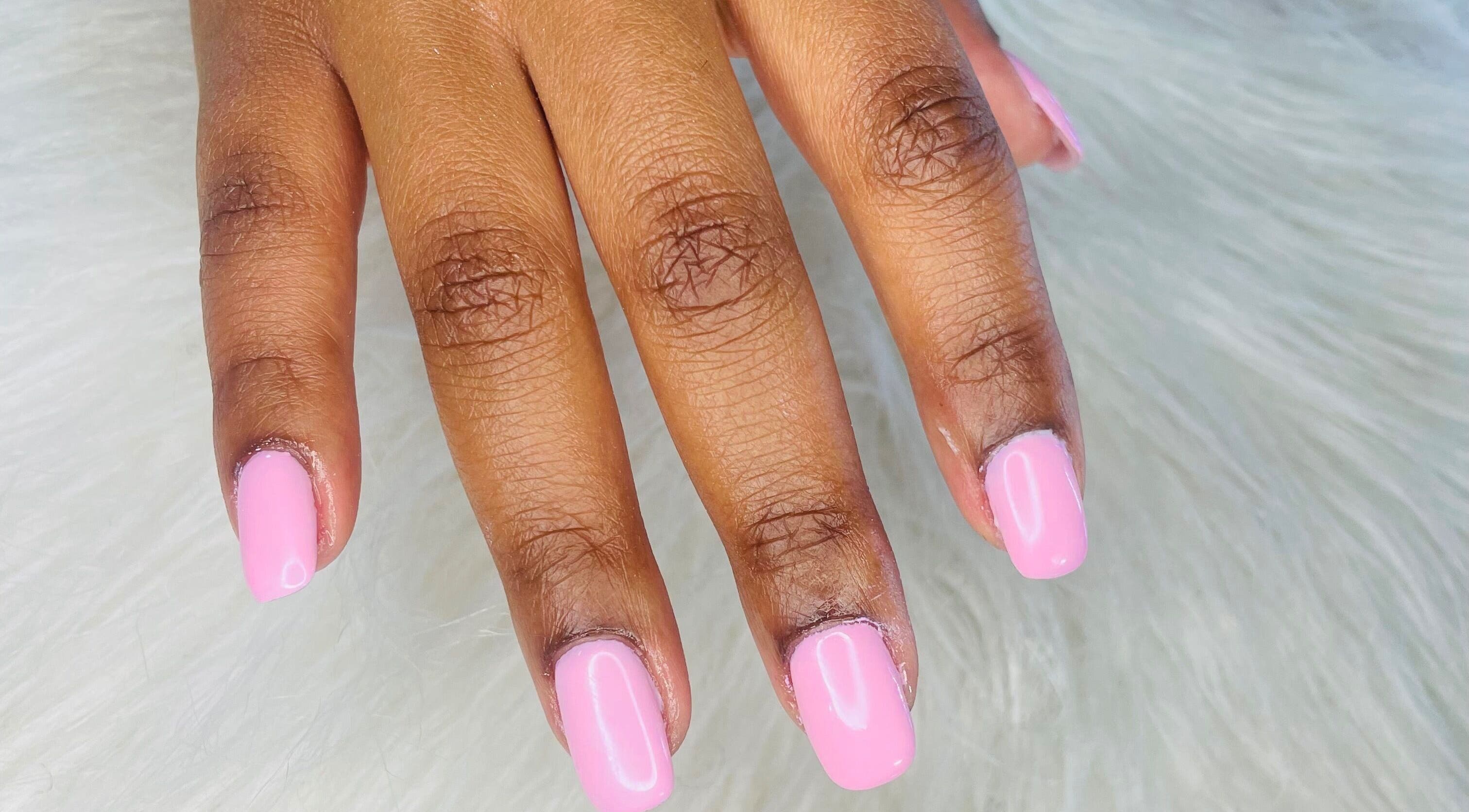 Close-up of manicured nails painted light pink at Trust Beauty Studio, Randburg, Gauteng, ZA.
