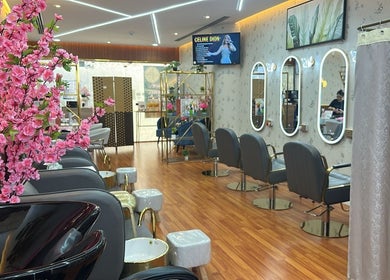 Elegant salon interior at Beauty Bond Salon, Riyadh, showcasing chic decor and styling stations.