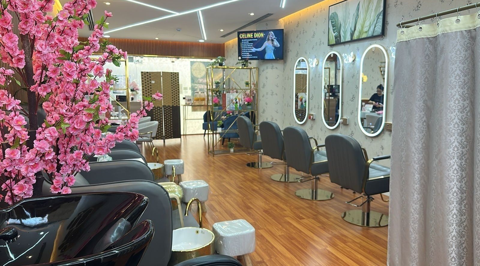 Elegant salon interior at Beauty Bond Salon, Riyadh, showcasing chic decor and styling stations.