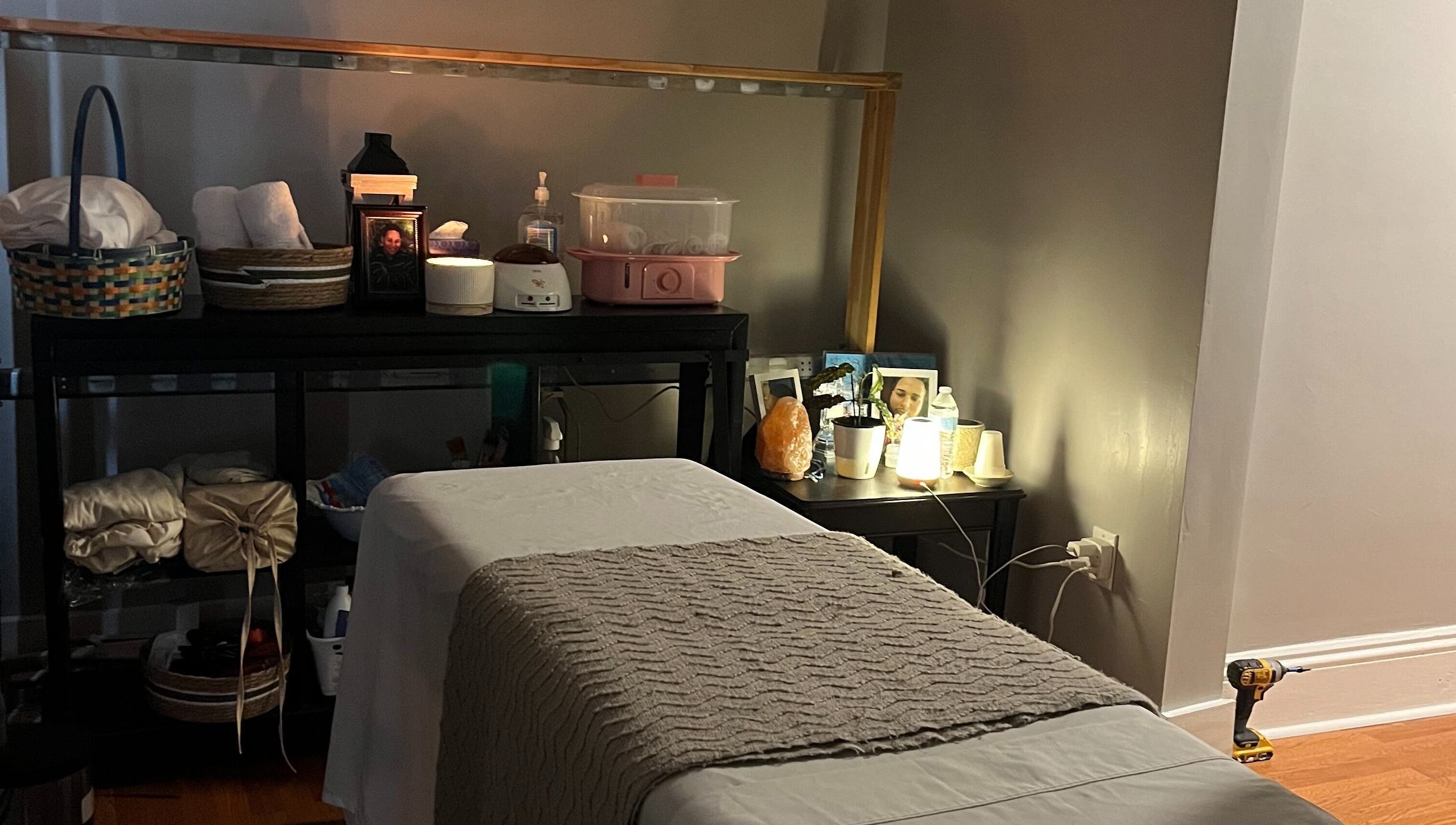 Relaxing massage room at H & A Spa in Cranston, Rhode Island, US, featuring a cozy treatment bed and warm lighting.