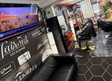 Interior of Klassik Barbershop in Ottawa, Ontario, CA with modern decor and barber chairs.
