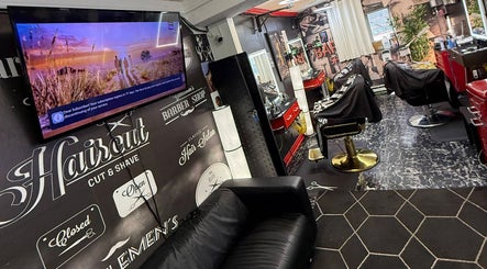 Interior of Klassik Barbershop in Ottawa, Ontario, CA with modern decor and barber chairs.