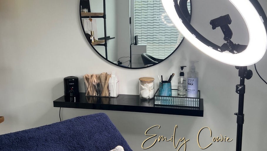 Cozy beauty setup at Emily Cowie Cosmetics, Wrentham, England, GB, featuring a ring light and mirror.