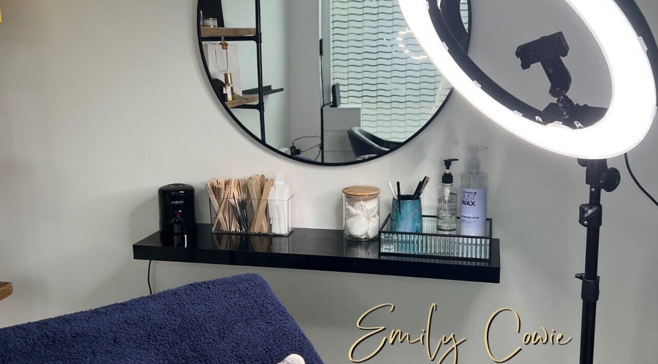 Cozy beauty setup at Emily Cowie Cosmetics, Wrentham, England, GB, featuring a ring light and mirror.