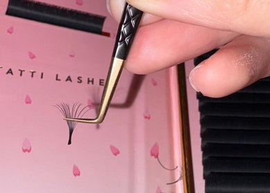 Eyelash extensions tweezed at BC Beauty Bar, Birchwood, England, GB, showcasing precision.