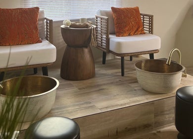 Relaxing foot spa chairs at Kali Rose Beauty, St. George’s, Saint George, AG, featuring luxurious decor.