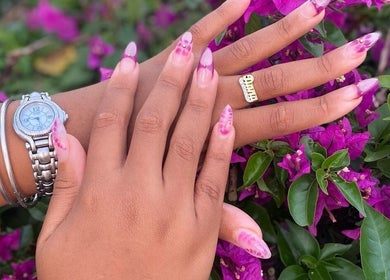 Elegant pink floral nails at Kali Rose Beauty, St. George’s, Saint George, AG. A showcase of exquisite nail artistry.