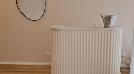 Elegant reception at Miss Volume, Rose Bay, New South Wales, AU with stylish decor and curved counter.