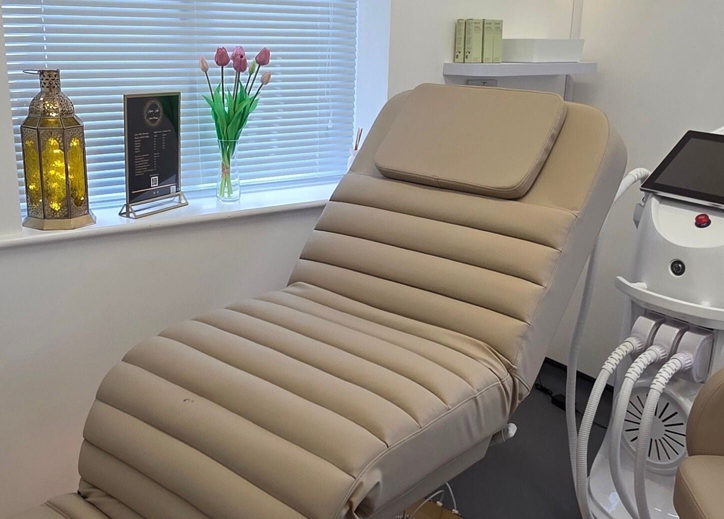 Luxury treatment room at Laser Lab & Sports Massage Clinic, Framlingham, England, GB, with massage chair and equipment.
