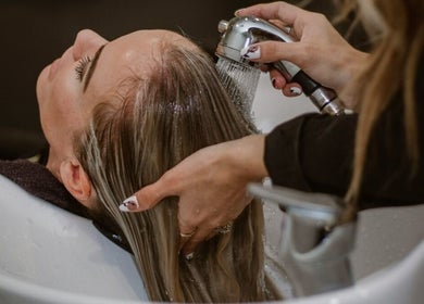 Hair wash service at SB Elite Elegance, London, England, GB, highlighting relaxing salon experience.