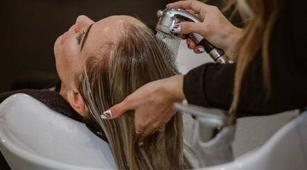 Hair wash service at SB Elite Elegance, London, England, GB, highlighting relaxing salon experience.