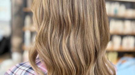 Elegant blond waves at Livedinbyerinx salon, Aberdeen, Scotland, GB, showcasing luxurious hairstyle.