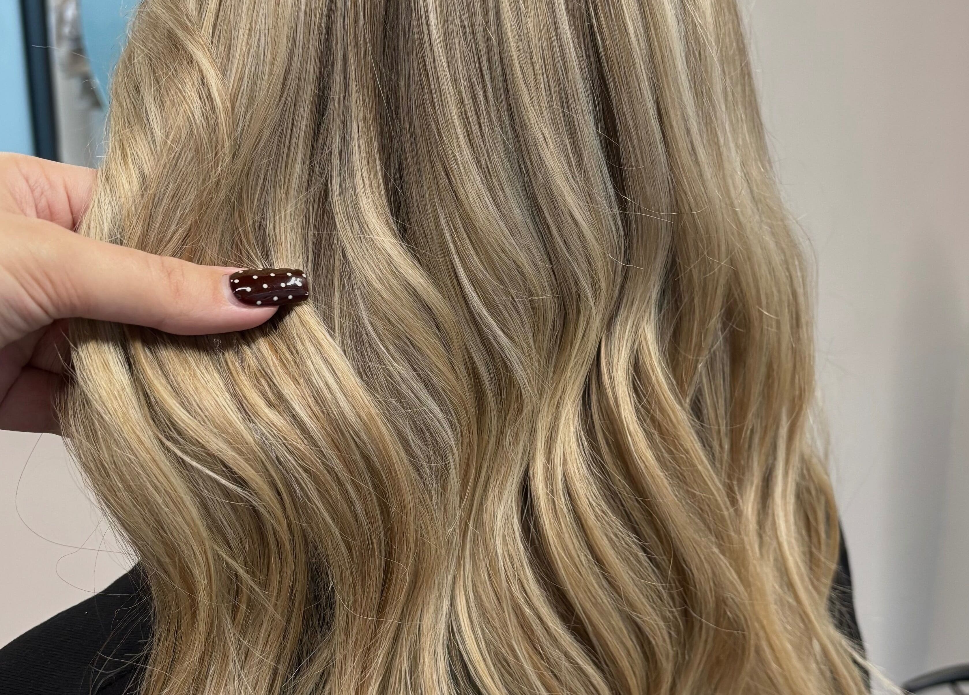 Blonde hair styled at Livedinbyerinx, Aberdeen, Scotland, GB, showcasing a wavy look.