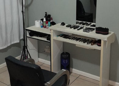 Neat setup of barber tools at Royal Barbershop, Pretoria, Gauteng, ZA, showcasing grooming instruments.