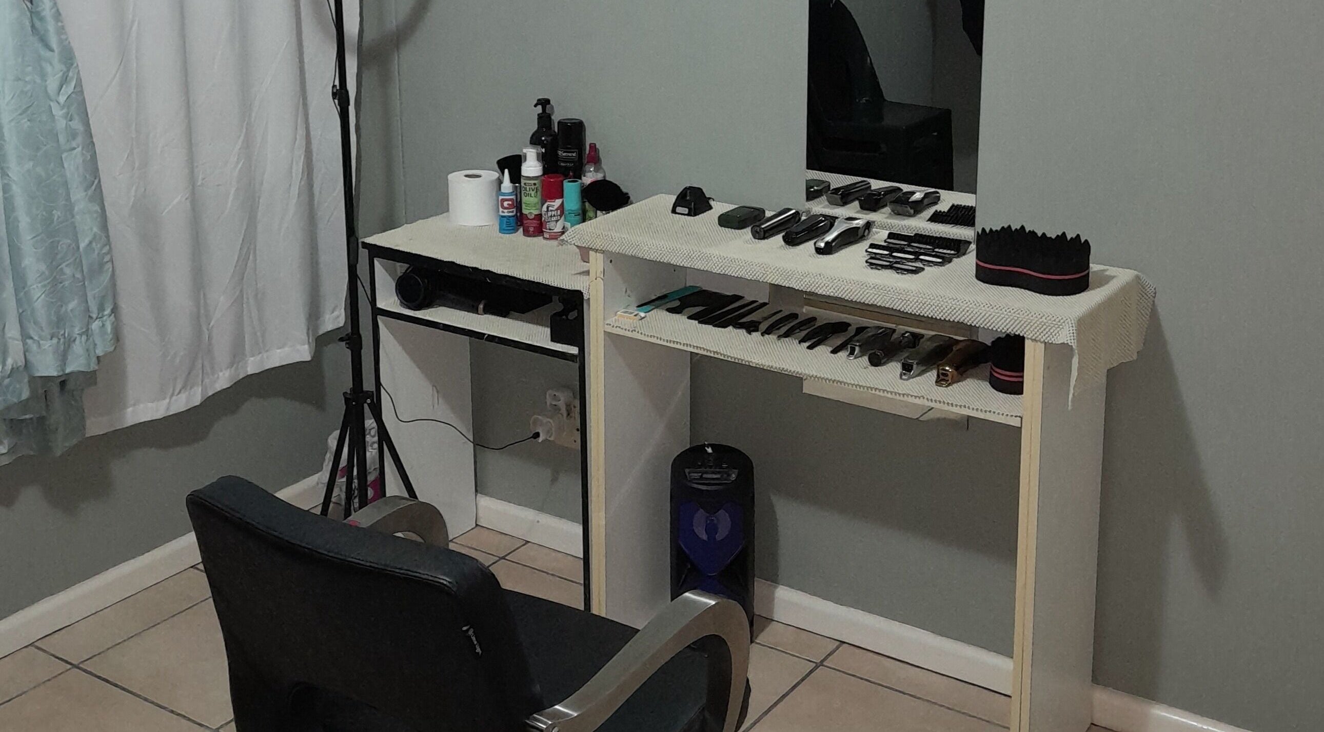 Neat setup of barber tools at Royal Barbershop, Pretoria, Gauteng, ZA, showcasing grooming instruments.