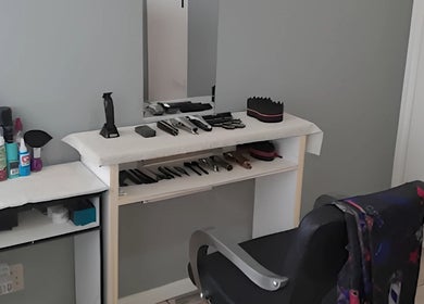 Barber station at Royal Barbershop, Pretoria, Gauteng, ZA showing tools and chair.