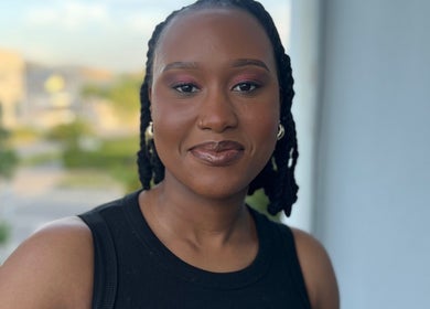 Smiling individual at Fleur Luxe Beauty, Cape Town, Western Cape, ZA, showcasing glowing skin.