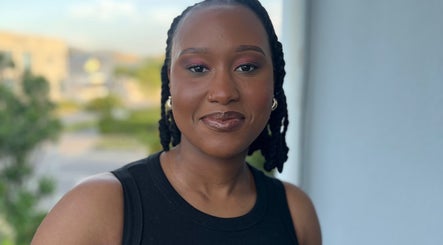 Smiling individual at Fleur Luxe Beauty, Cape Town, Western Cape, ZA, showcasing glowing skin.