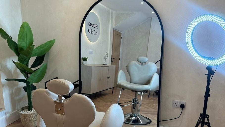 Leila Keogh Hair salon, Royal Leamington Spa, features stylish chairs and modern decor.