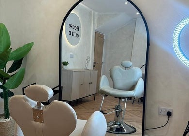 Leila Keogh Hair salon, Royal Leamington Spa, features stylish chairs and modern decor.