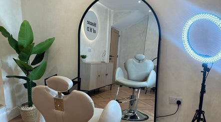 Leila Keogh Hair salon, Royal Leamington Spa, features stylish chairs and modern decor.