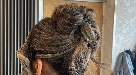 Elegant updo hairstyle created at Leila Keogh Hair, Royal Leamington Spa, England, GB, showcasing chic braiding.