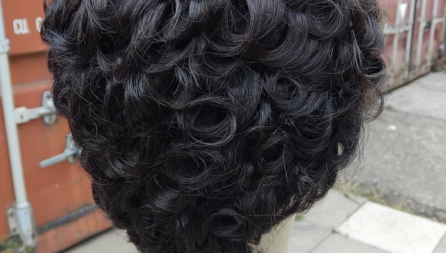 Close-up of intricate curls styled at Bozenga Beauty, Manchester, England, GB, showcasing hair artistry.