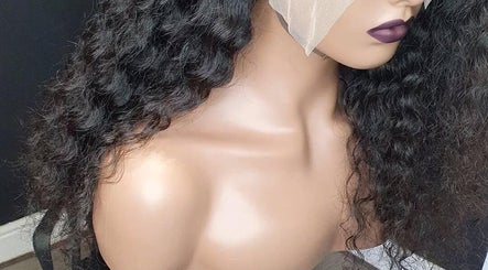 Curly wig displayed at Bozenga Beauty, Manchester, England, GB, showcasing premium hair texture and style.
