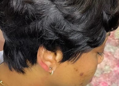 Stylish short black haircut at Bozenga Beauty, Manchester, England, GB.