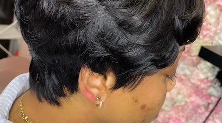 Stylish short black haircut at Bozenga Beauty, Manchester, England, GB.