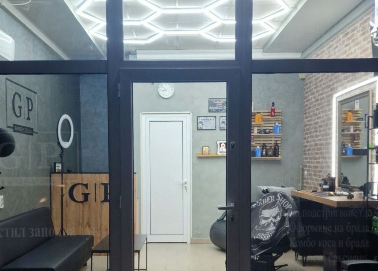 Modern interior of GP Barber Studio in Harmanli, Haskovo, BG showcasing stylish decor and grooming products.