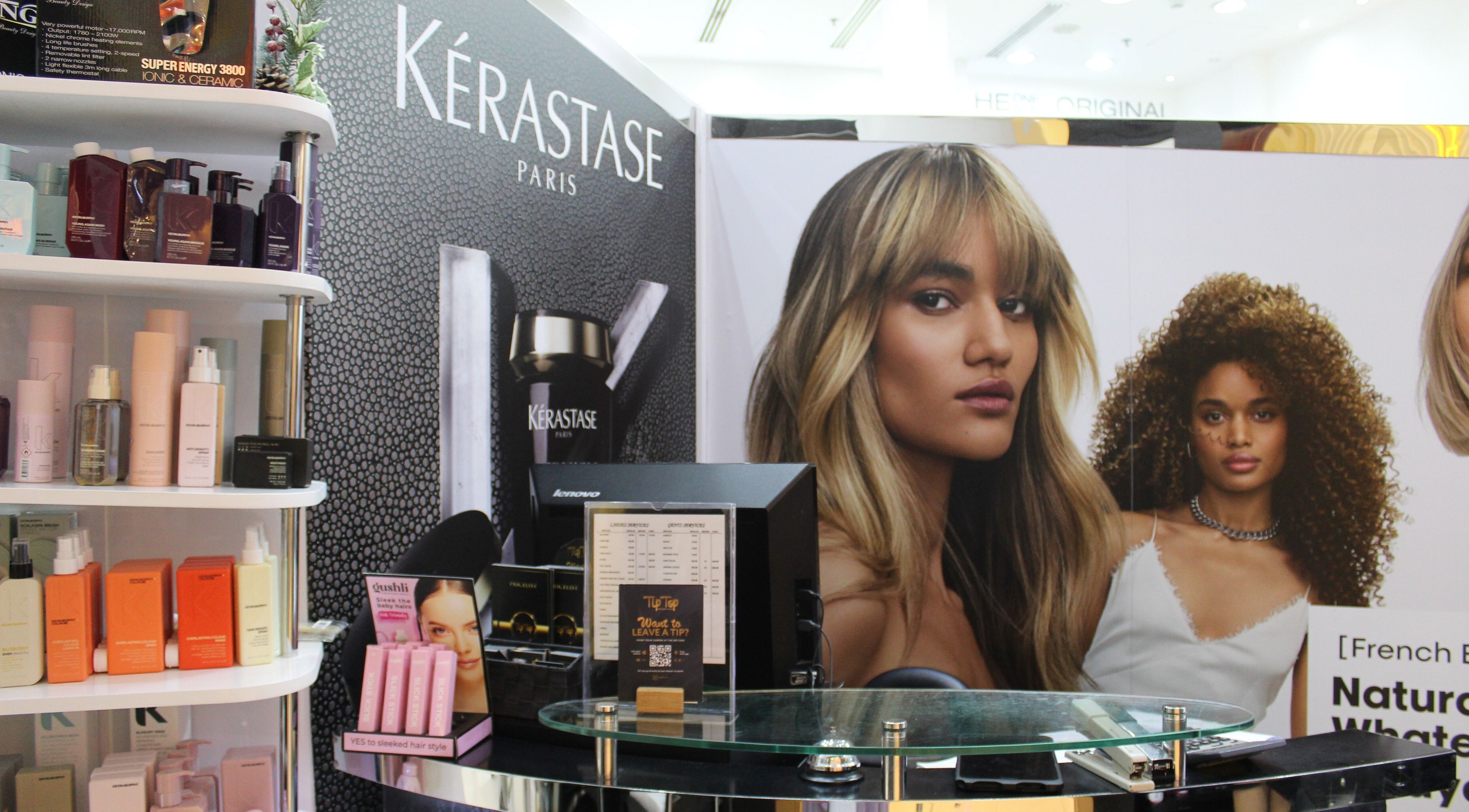 Kerastase display at Tip Top by Mounir Hair Beauty Salon, Dubai, showcasing premium hair products.