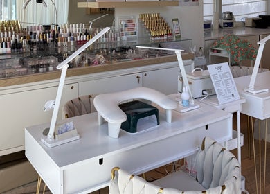 Modern nail station at MueseoYu Nail, Vancouver, British Columbia, CA, showcasing elegant design and equipment.