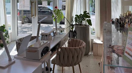 Elegant interior of MueseoYu Nail in Vancouver, British Columbia, CA with stylish seating and natural light.