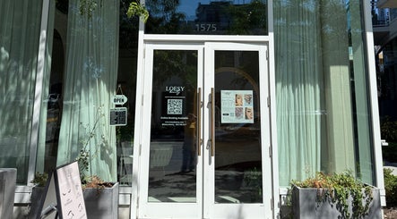 Front entrance of MueseoYu Nail in Vancouver, British Columbia, CA with open sign and details displayed.